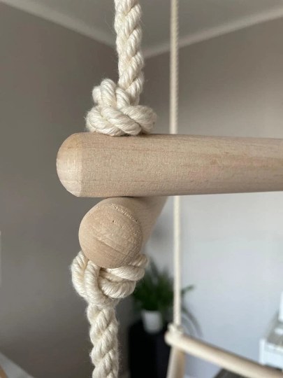 A 3-sided rope ladder made of real oak wood with 5 steps, knot close-up view.