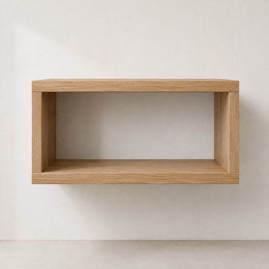 A minimalist floating bathroom vanity made of light oak wood, shown mounted on a neutral off-white wall.