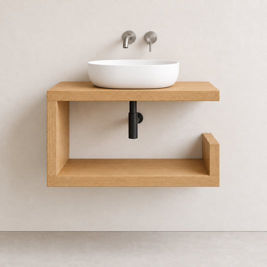 A modern floating solid oak bathroom vanity with a white vessel sink and matte black drain, mounted on a minimalist beige wall.