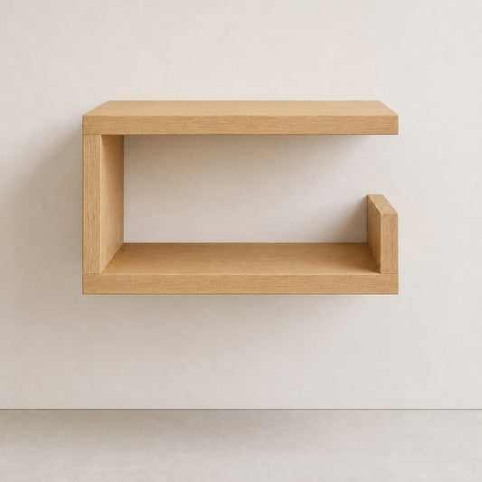 A minimalist light oak floating wall shelf with a modern C-shaped design and open middle compartment, mounted on a neutral off-white wall.