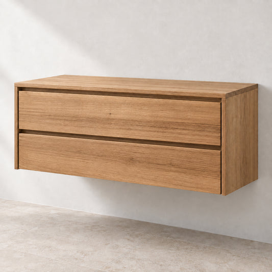 A modern two-drawer floating wooden cabinet with a warm oak finish, mounted on a textured light gray wall above a neutral floor.